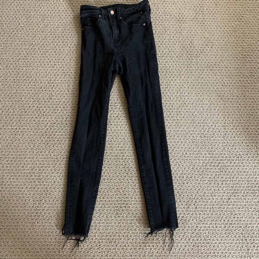 Buckle black skinny jeans